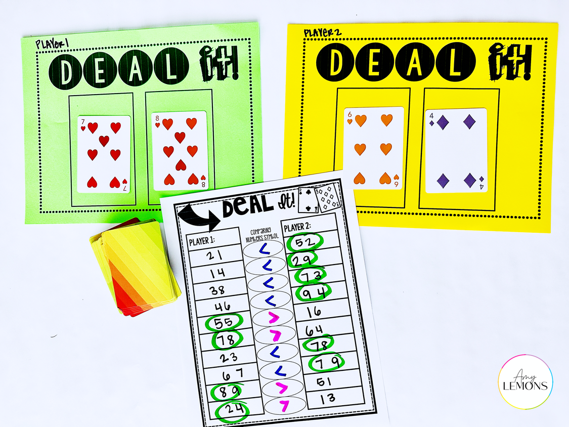 Deal It partner card game using playing cards to compare numbers with a recording sheet.