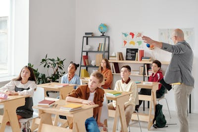 A teacher teaching a class of students