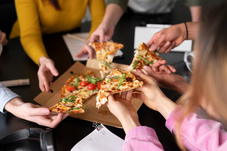 friends sharing delicious pizza