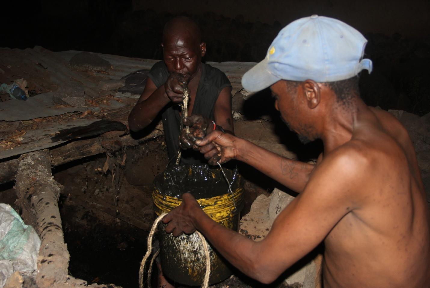 Passing the faecal sludge to the top of the pit latrine