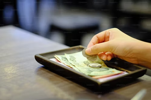 Money resting on a plate