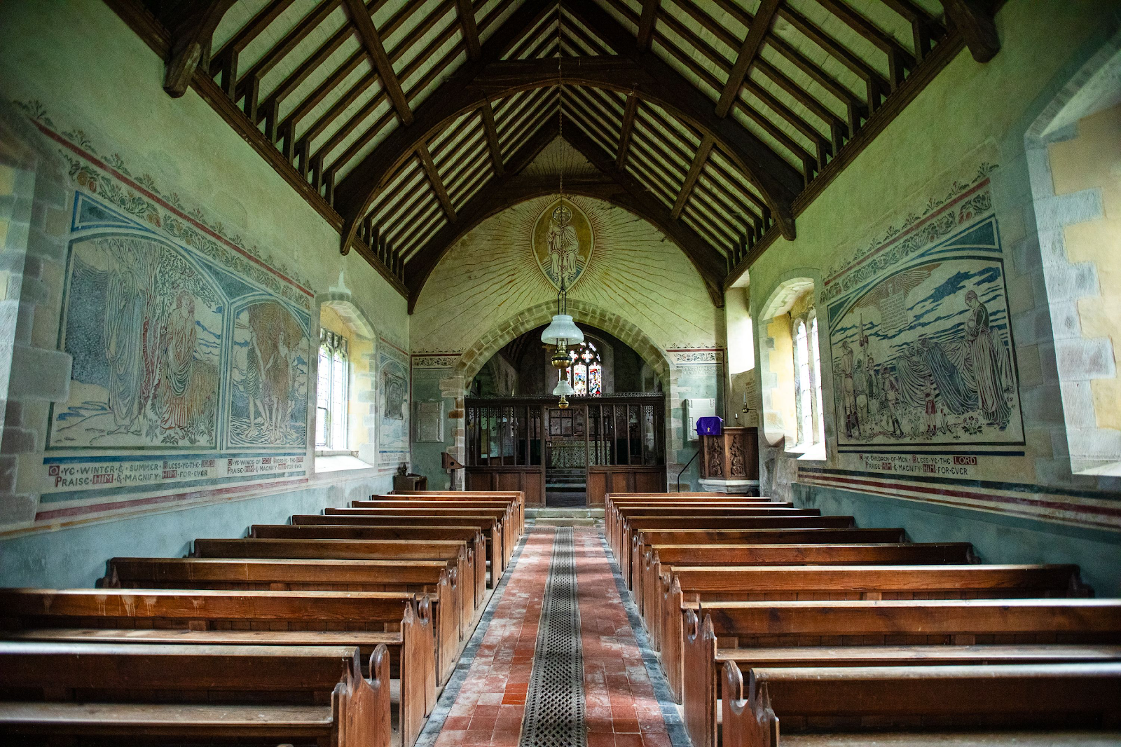 A church with wooden benches

Description automatically generated