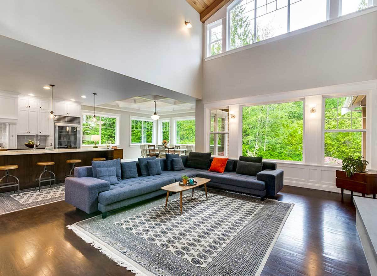 An open layout view showing the living room, kitchen, and dining area.