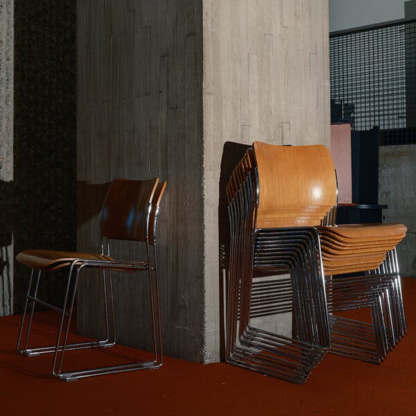 A photograph of stacks of chairs at a college campus.