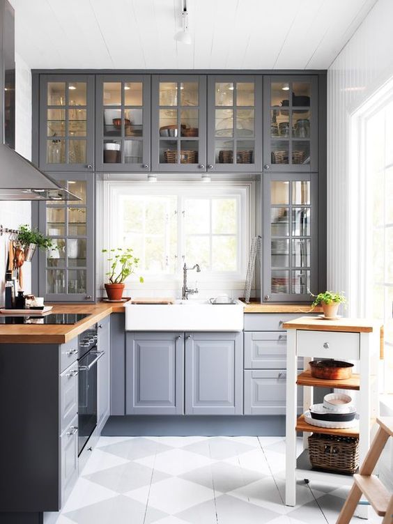 Kitchen with tall cabinets extending to the ceiling.