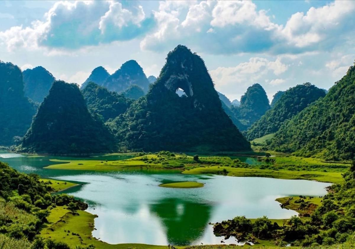 Li River surrounded by mountainsDescription automatically generated