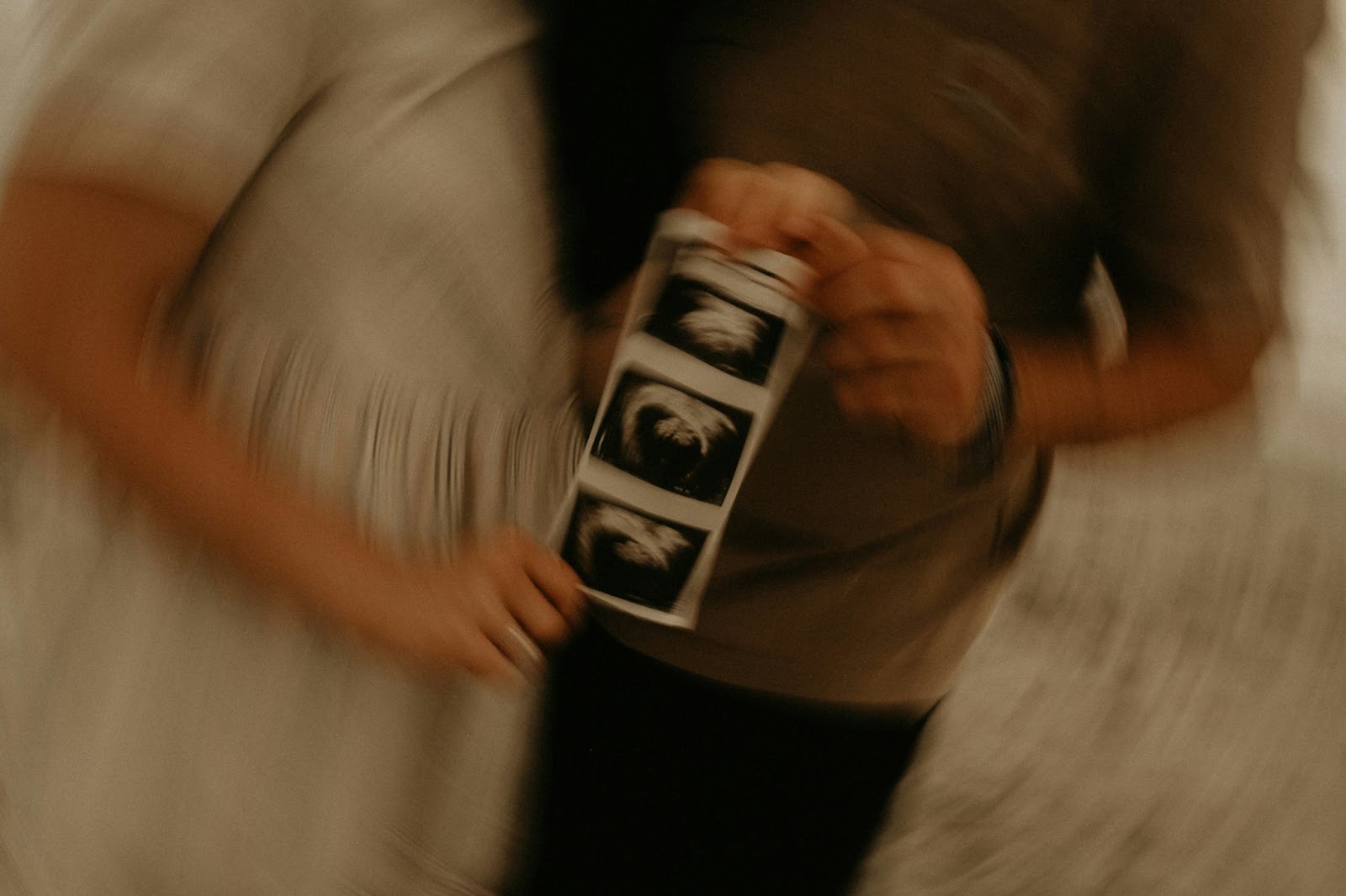A man and woman holding a ultra sound.