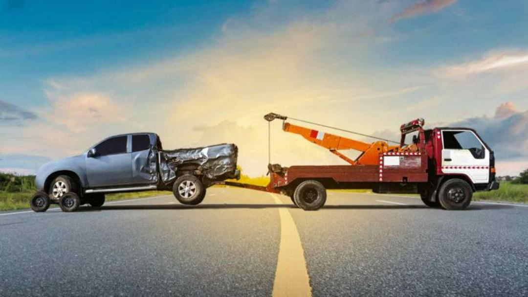 A Truck involved in an accident being tolled out of the road. 