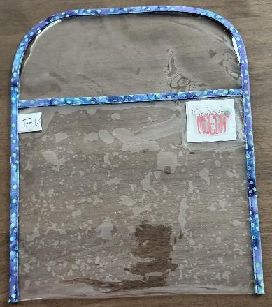 A clear plastic bag with a blue border

AI-generated content may be incorrect.