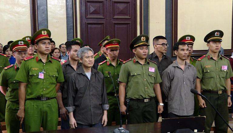 Activists who were charged with subversion stand trial in Ho Chi Minh City in October 2018.