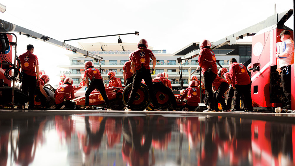 The Scuderia Ferrari HP pit crew during a pit stop at the British Grand Prix