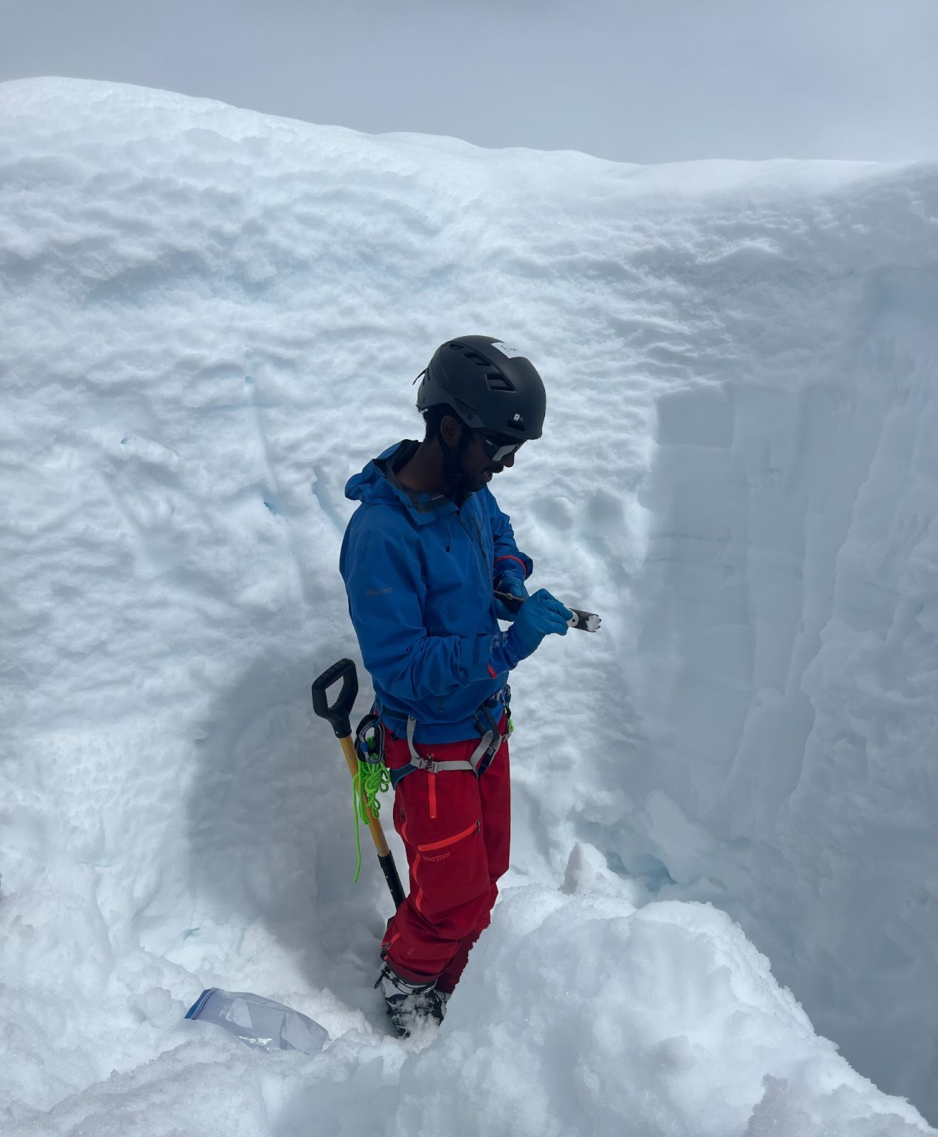 The author standing inside a ~3 meter deep mass balance pit.