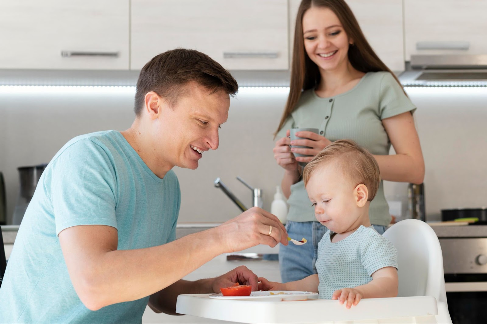 Parents feeding their child