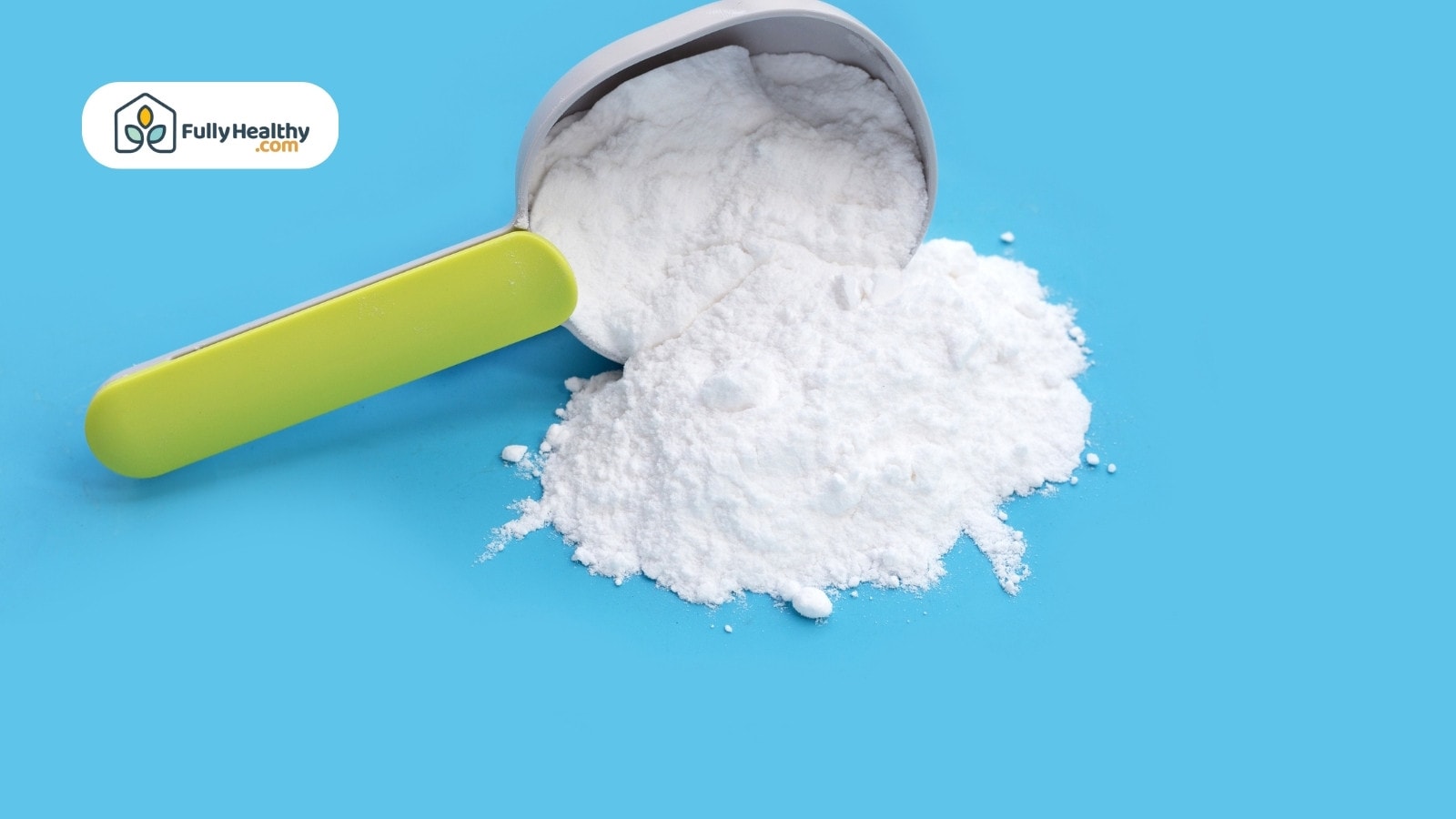 Measuring scoop spilling white powder on bright blue background