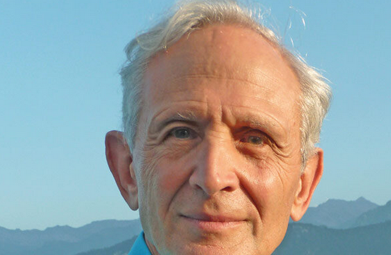 photo of a man against an outdoor background