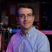 Portrait of Professor Hanneke smiling and wearing a light blue button-down shirt. 