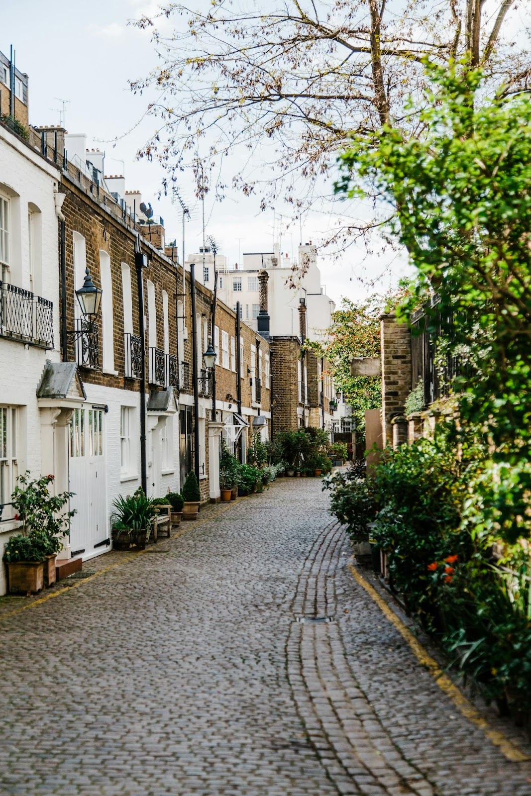 London street scene with terraced houses and cobbled street