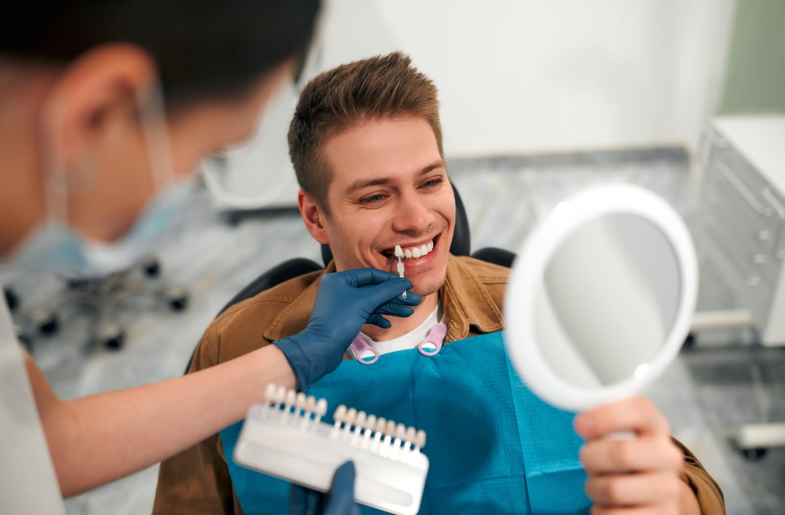 A patient and their dentist work together during their try-on veneer appointment to find the right colour, shape, and size.