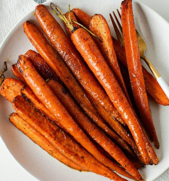 Roasted glazed carrots on white plate