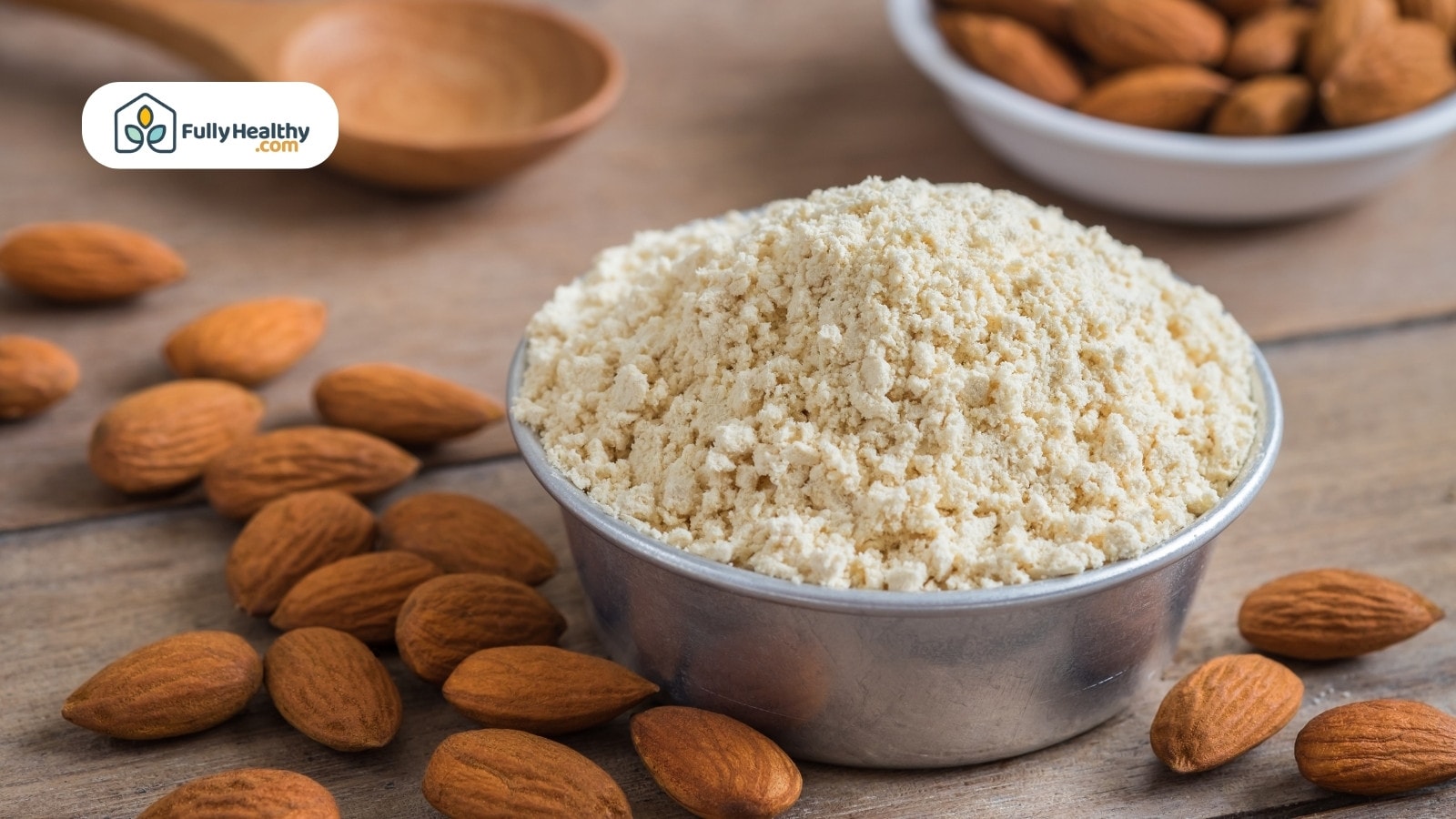 Bowl of almond flour with whole almonds scattered