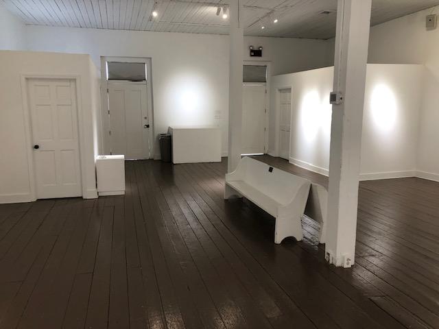 A white bench in a room AI-generated content may be incorrect.