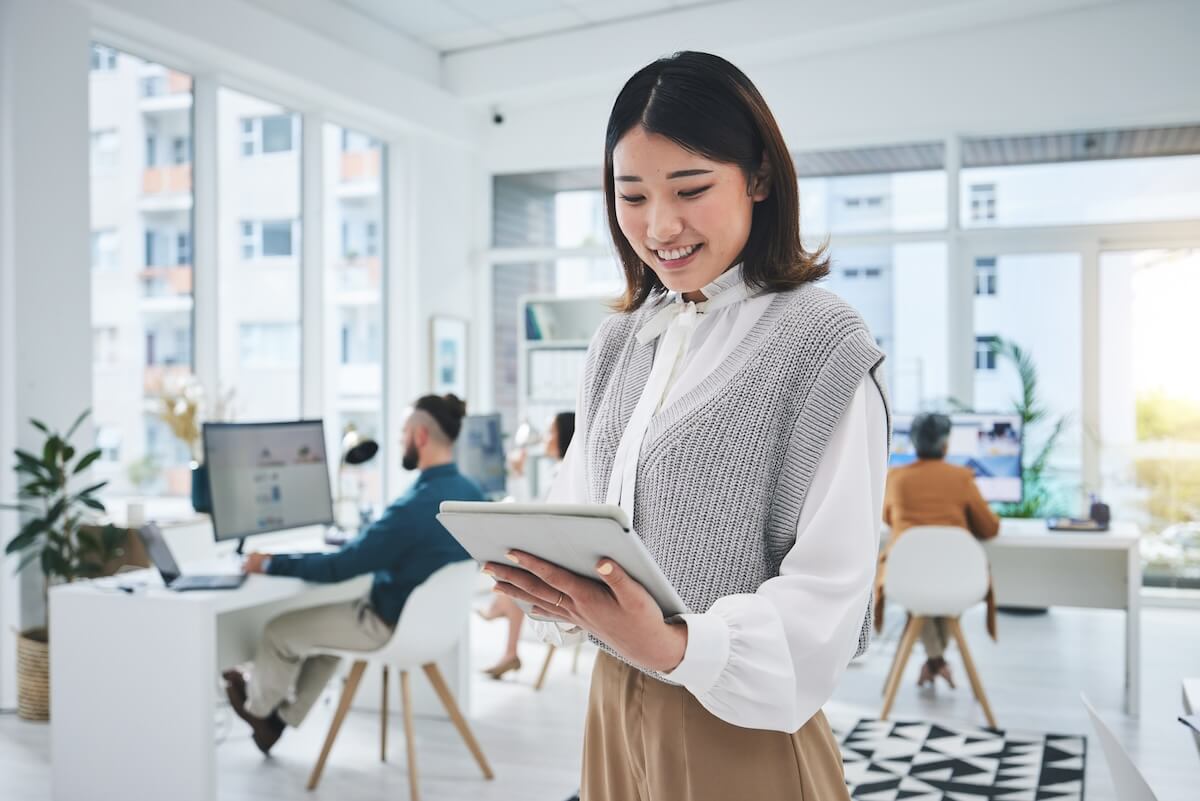 No code automation: entrepreneur happily using her tablet