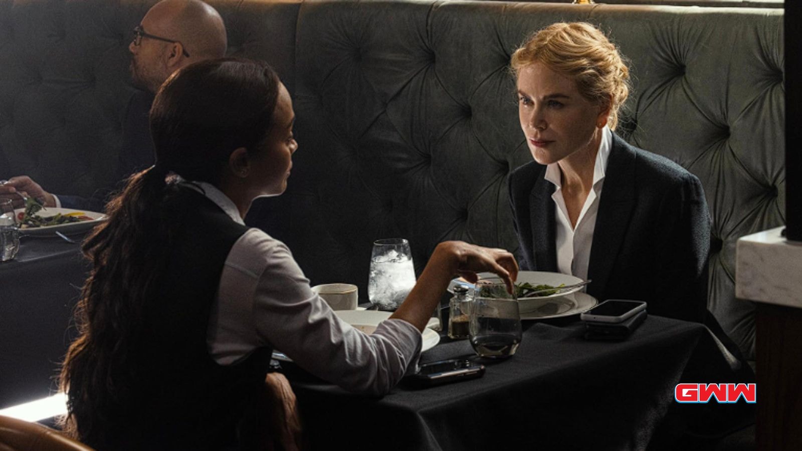 Zoe Saldaña and Nicole Kidman discussing strategy over lunch in Special Ops: Lioness