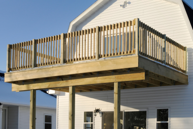 is it worth it pros and cons of a second story home addition outdoor decking area custom built michigan