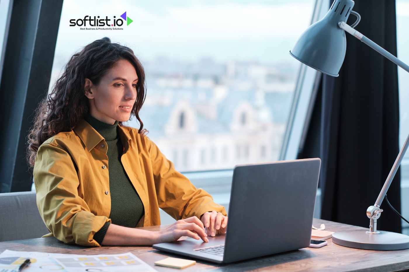 a woman typing on her laptop