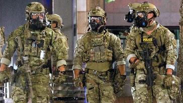 A group of people in military uniforms

AI-generated content may be incorrect.