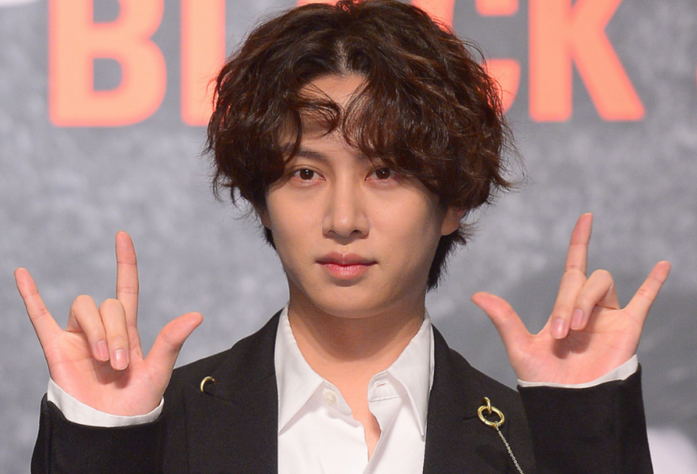 This contains an image of Super Junior Heechul
