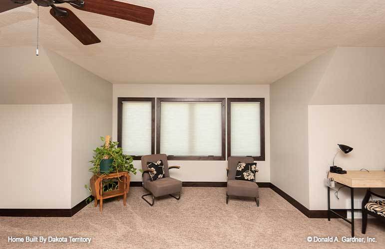 Here's another sitting area showcasing cushioned chairs and wooden tables.