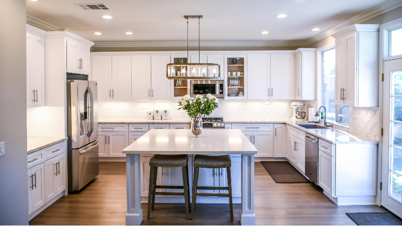 Beautiful chandelier illuminating the kitchen 