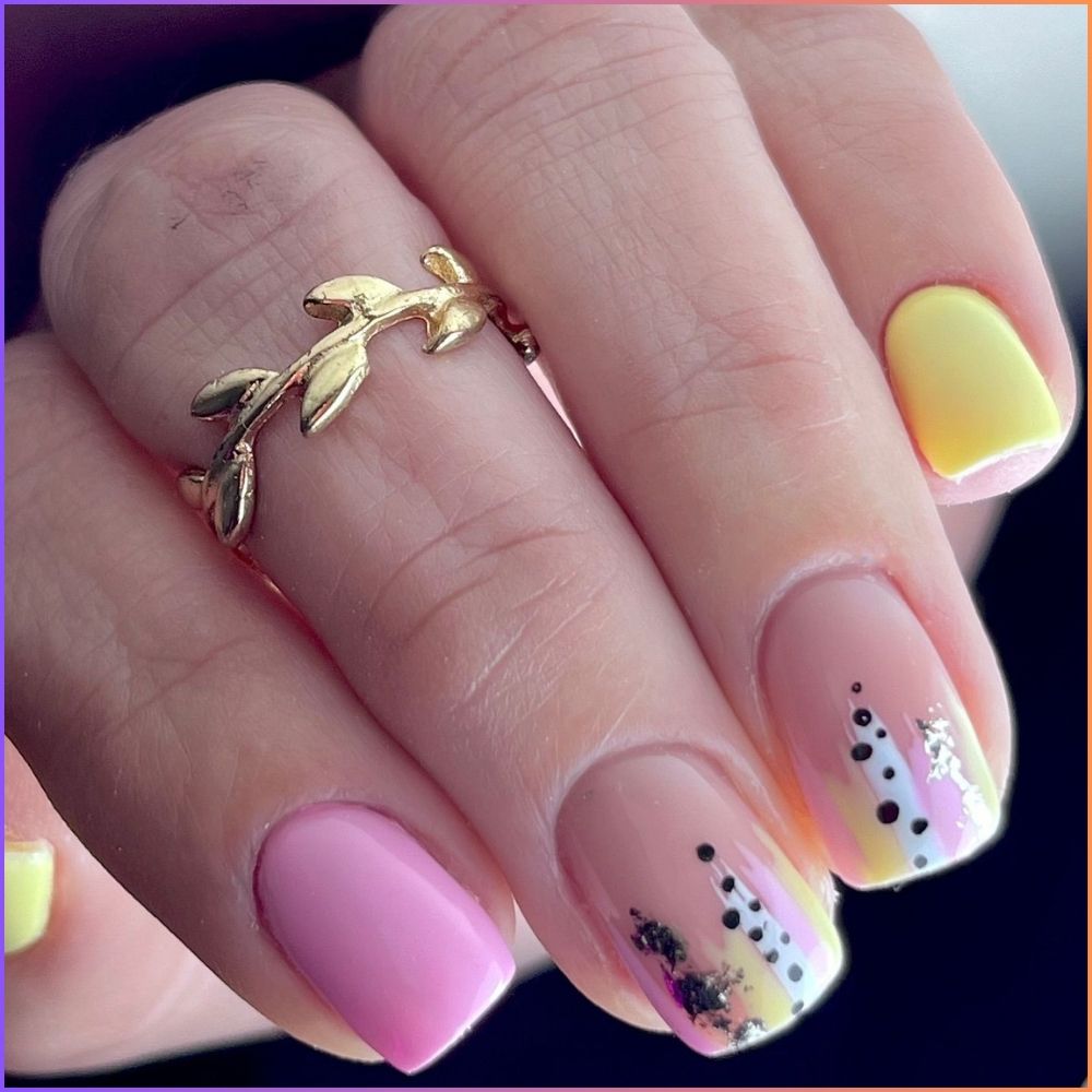 Close up of nails with simple pink nail designs having Pink and Yellow Nail Designs