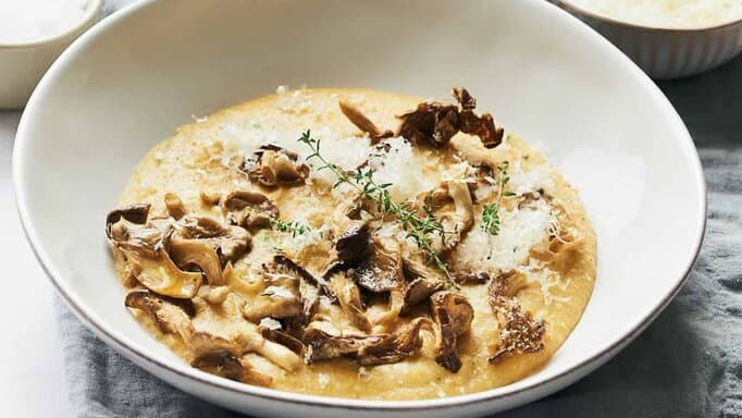 Vegan Polenta with Roasted Mushrooms in a big white bowl.