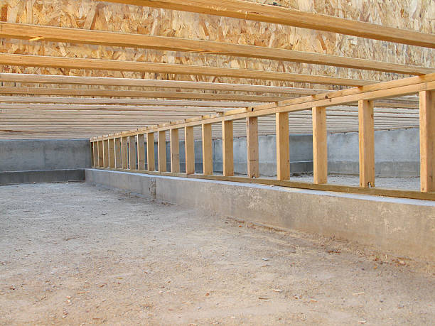 Wooden floor joists in encapsulated crawl space foundation