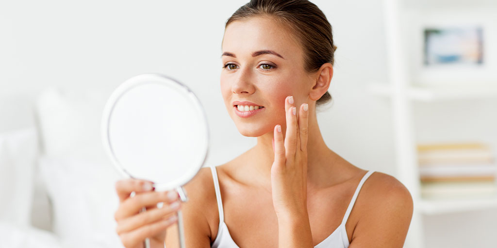 in this image the girl see the after laser treatment results.