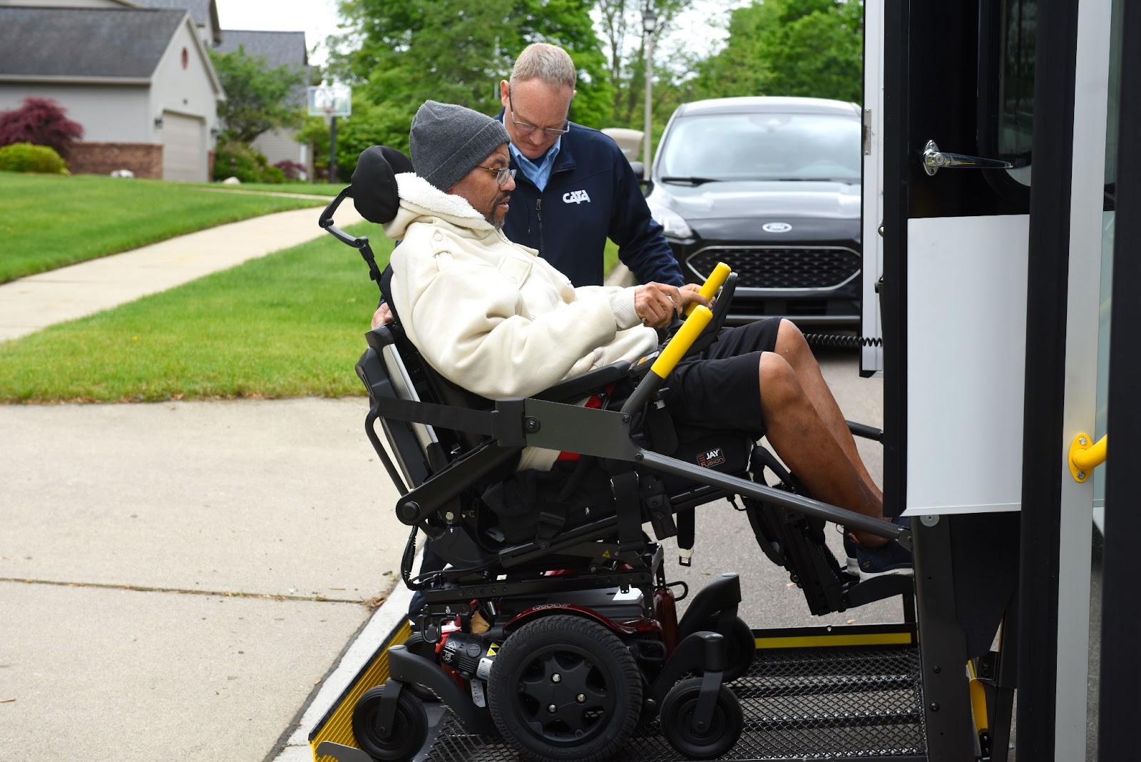 A disabled rider boarding a spec tran bus A disabled rider boarding a spec tran bus