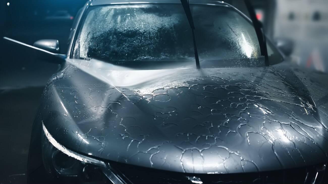 A car covered in water

Description automatically generated