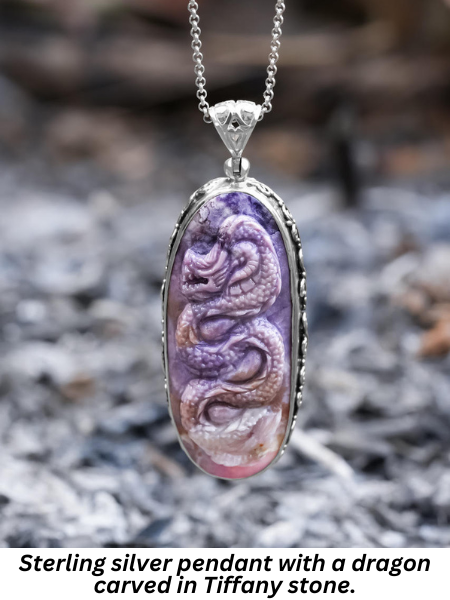 Sterling silver pendant with a dragon carved in Tiffany stone