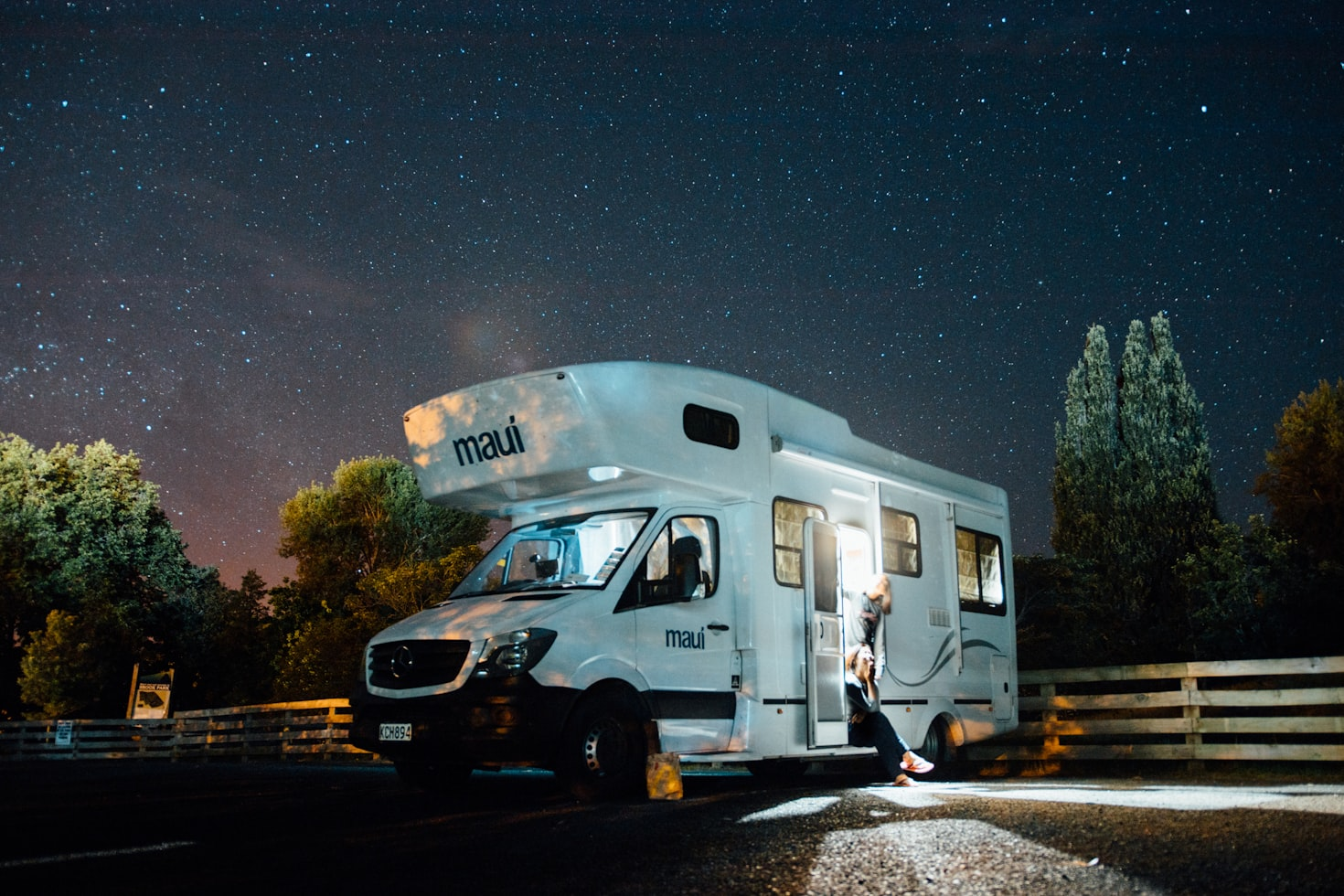 An RV parked at night