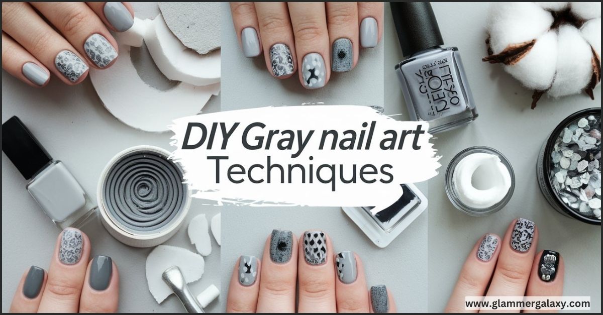 Hands with gray nail art, bottles of polish, cotton, and stones on a table.