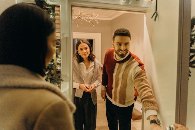 A couple opening a door