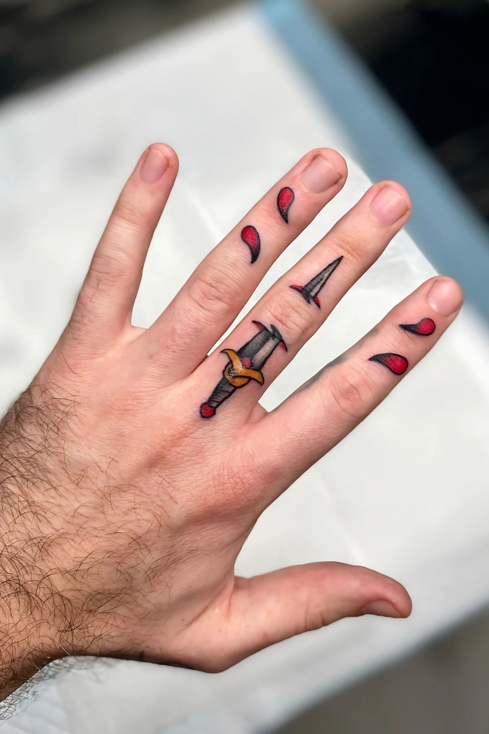 Bold Sword Finger Tattoo