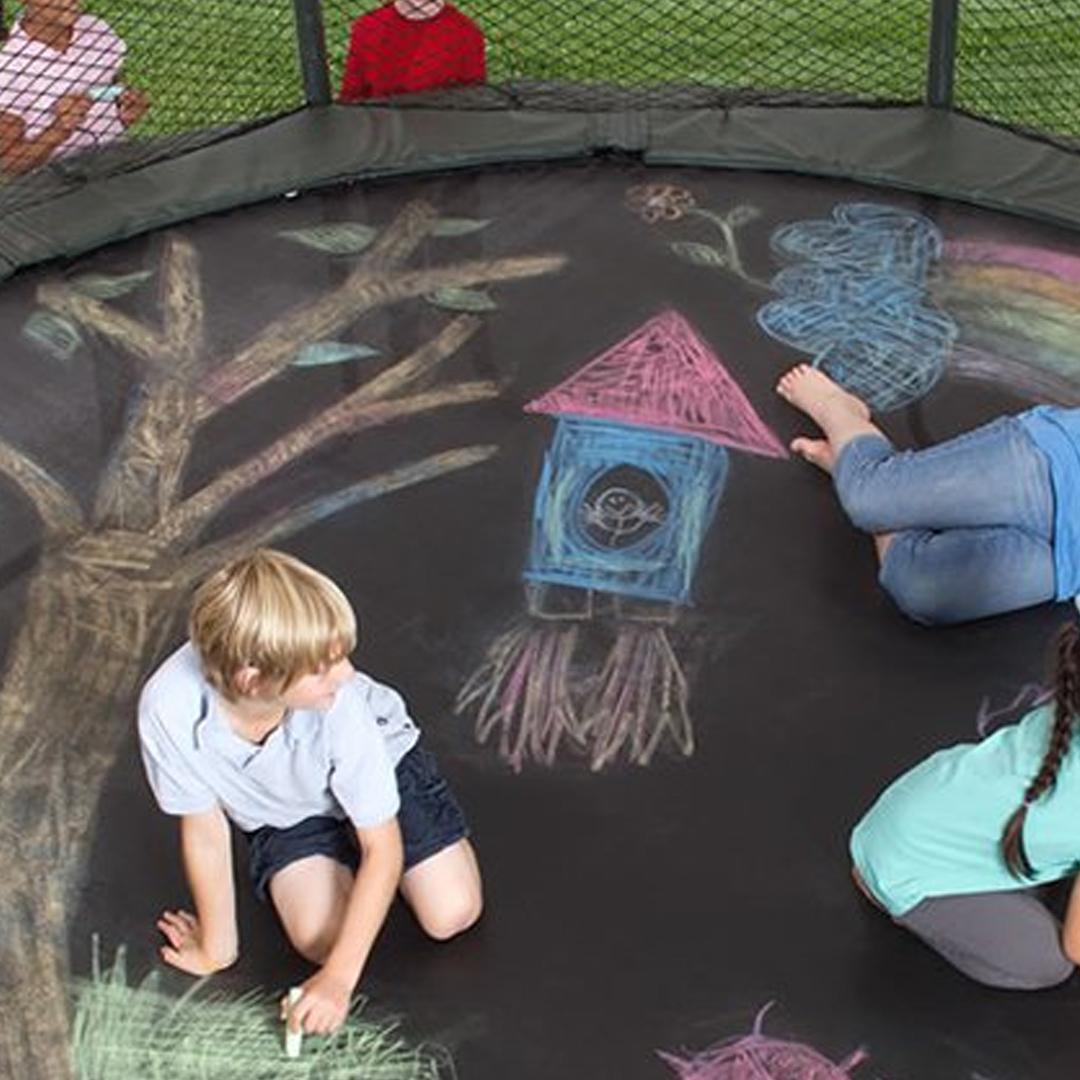 Boy drawing on 12ft Round Trampoline with Enclosure - supertramp.co.uk