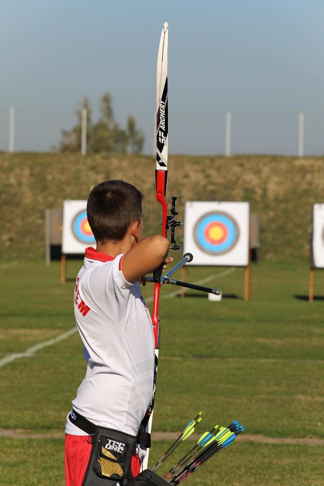 A child holding a bow and arrow

AI-generated content may be incorrect.