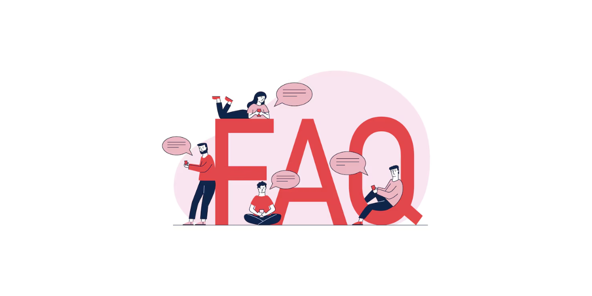 4 people sitting in and around a giant FAQ sign
