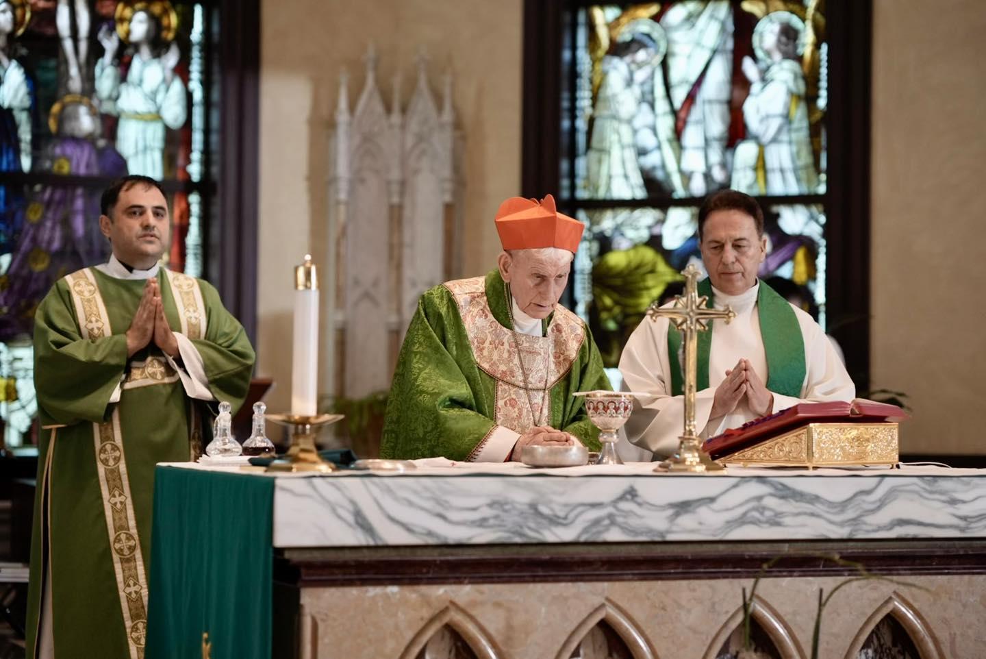 May be an image of 3 people, the Basilica of the National Shrine of the Immaculate Conception and text