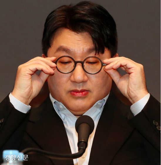 This contains an image of HYBE chairman Bang Si Hyuk