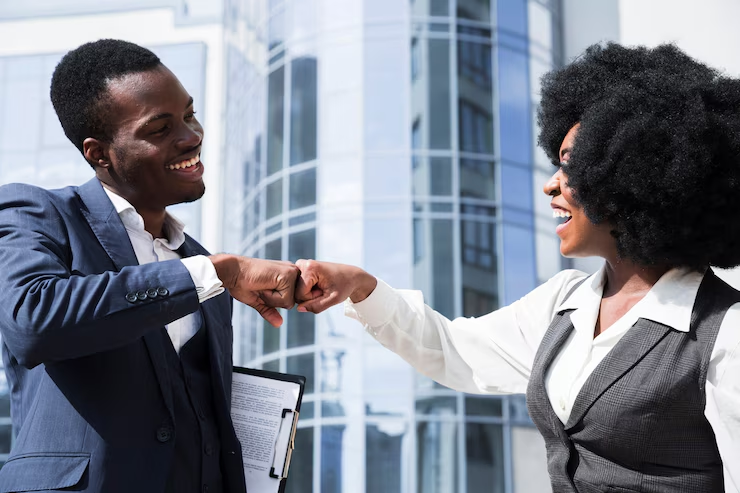 A candidate and employer sharing a fistbump